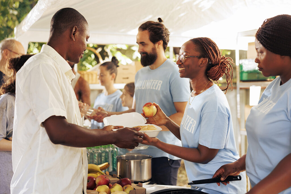 Volunteers handing out free food and necessities to the less fortunate. 