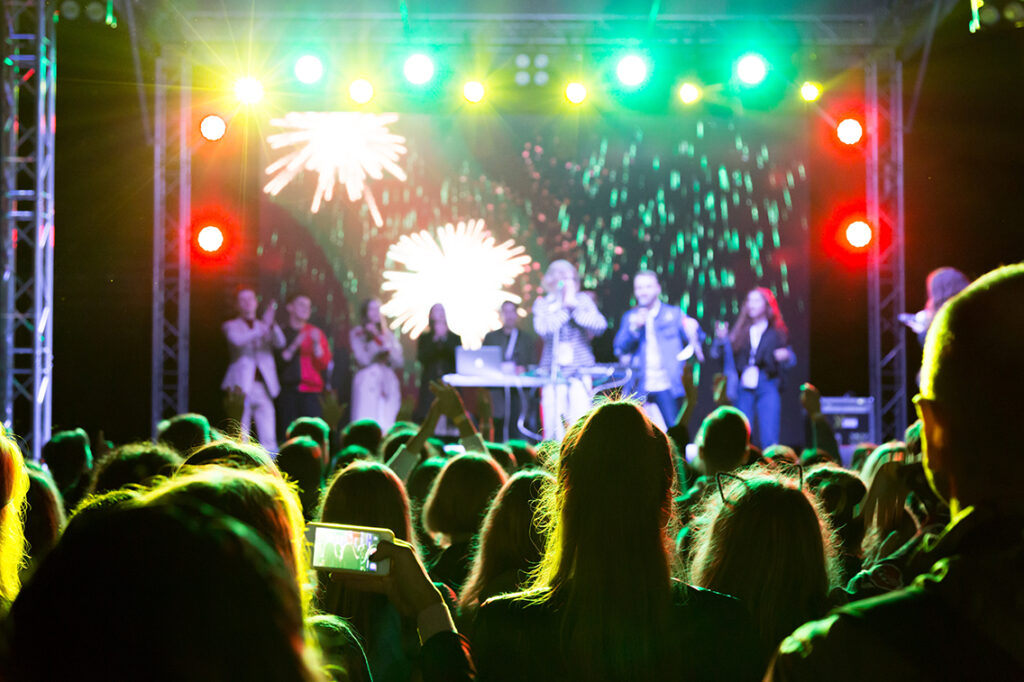 A charity concert with a packed audience.