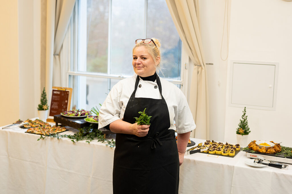 Chef in front of the catering display.