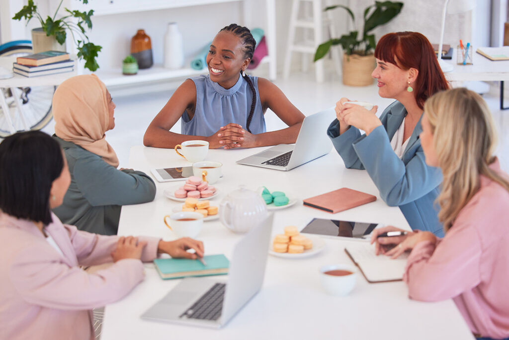 Business people in a meeting, planning ideas around a table