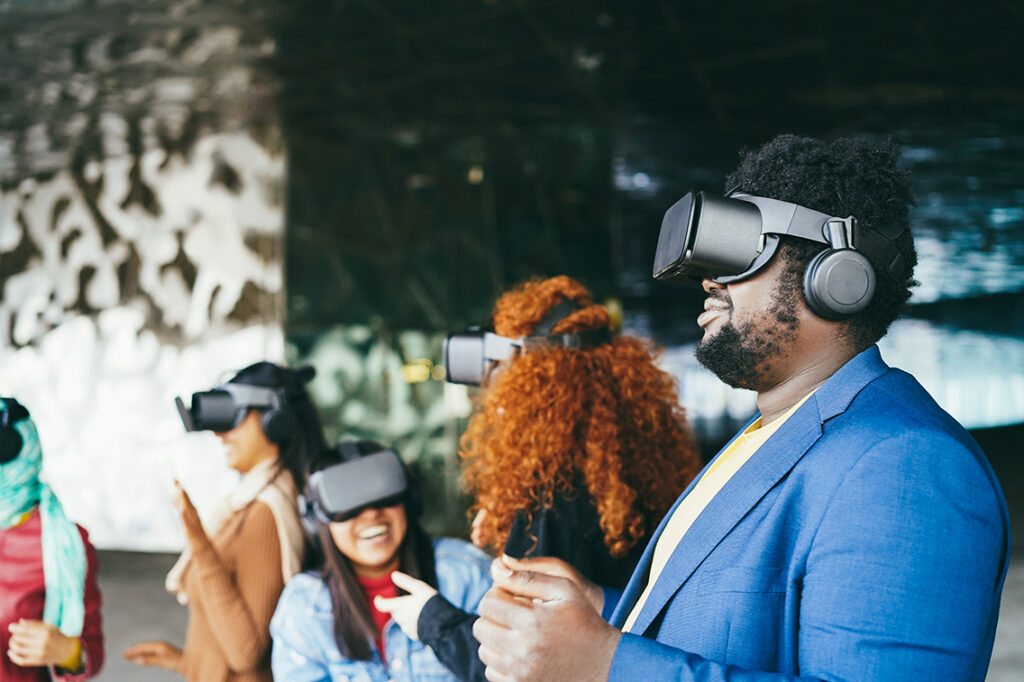 Young people wearing VR headsets outdoor